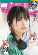 A magazine with a girl wearing headphones on the cover.