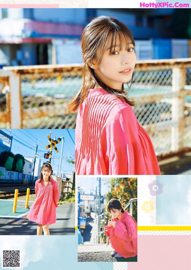 A woman in a pink dress standing on a train track.
