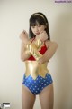 A woman in a Wonder Woman costume posing for a picture.